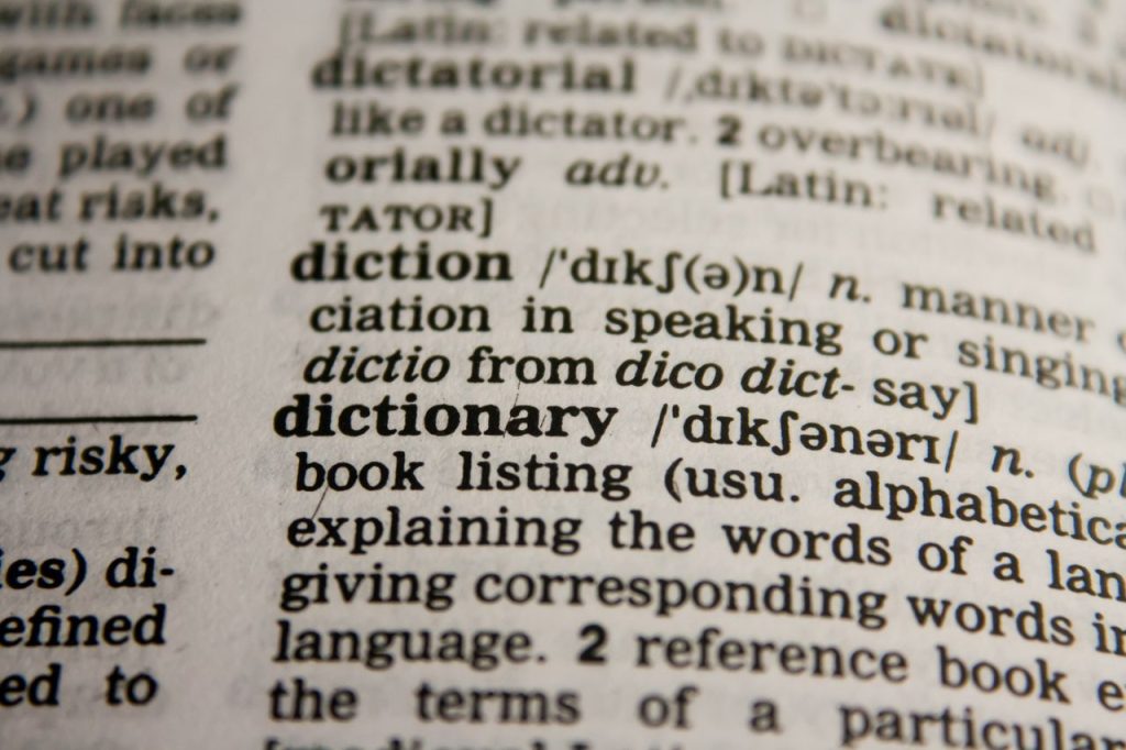 Crafting Captivating Headlines: Your awesome post title goes here Detailed close-up view of a dictionary page highlighting the word 'dictionary' and its definition.