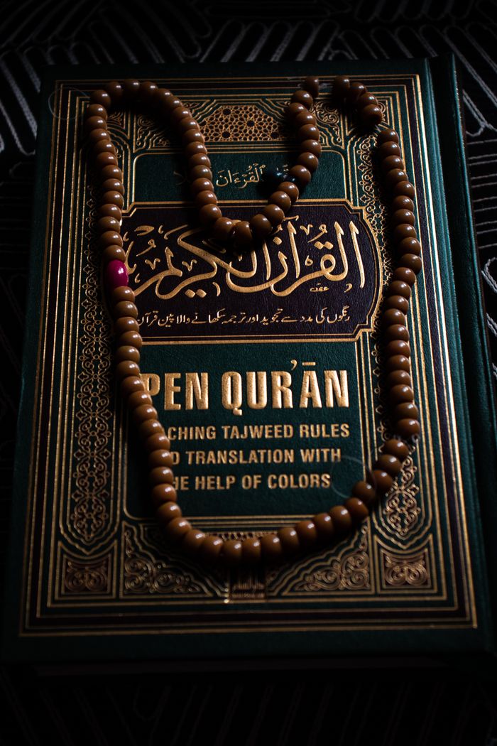 Intricate design of a Quran with prayer beads, symbolizing Islamic faith and spirituality.